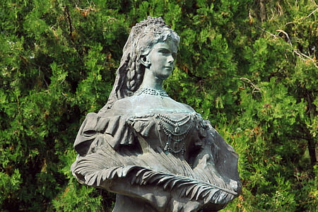 statue of woman holding feather thumbnail