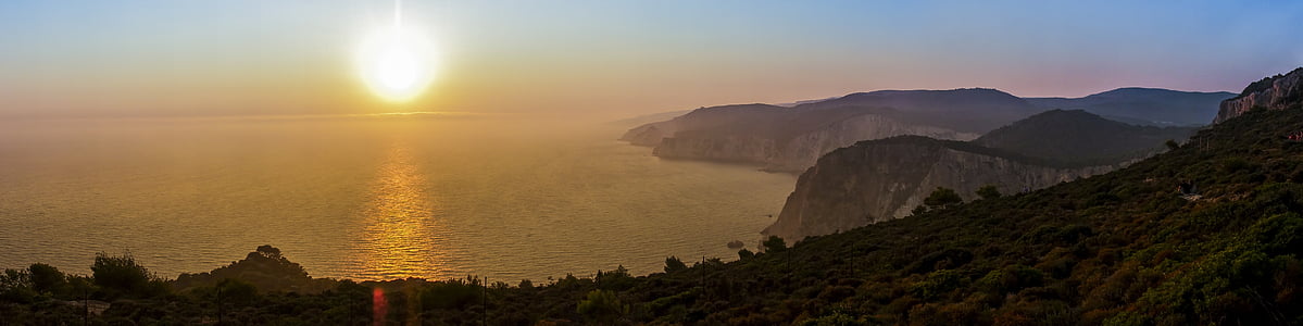 rearr view of blue ocean under sunrise thumbnail