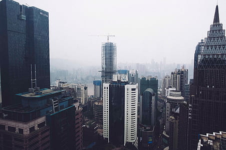 high-angle photo of skyscrapers during cloudy day thumbnail