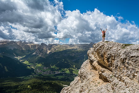 person standing beside cliff thumbnail
