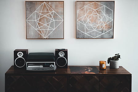 Black Shelf Stereo on Brown Wooden Sideboard thumbnail