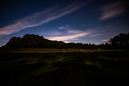 silhouette of mountain with blue and gray skies thumbnail