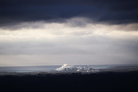 aerial view of city under nimbus cloud thumbnail