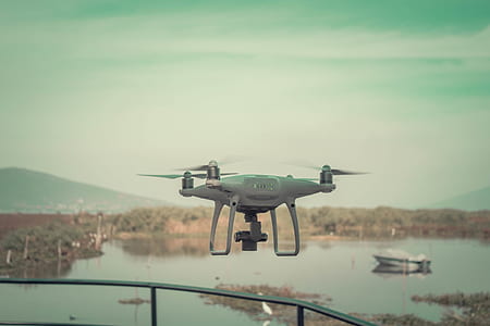 gray and black quadcopter drone thumbnail