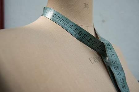 blue tape measure on beige mannequin thumbnail