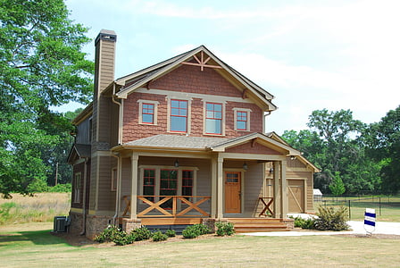 brown and beige wooden 2-storey house thumbnail
