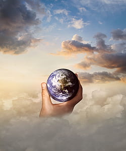 person holding earth digital wallpaper thumbnail
