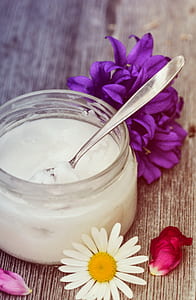 stainless steel spoon on top of clear glass container thumbnail