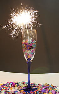 turned-on sparkler in clear glass champagne flute thumbnail