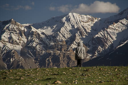 man standing on grass field thumbnail