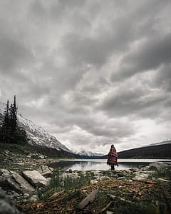 Person Standing Near Body of Water thumbnail