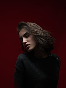 woman wearing black sweater leaning her head beside while closing her eyes thumbnail