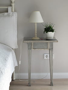 white table lamp on the top of grey wooden side table thumbnail