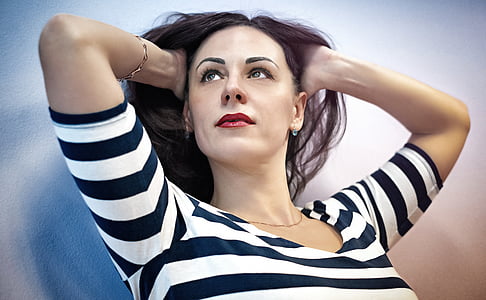 woman in white and black striped scoop-neck 3/4 sleeved shirt painting thumbnail