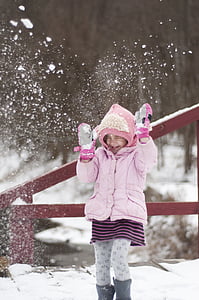 girl playing on snow thumbnail