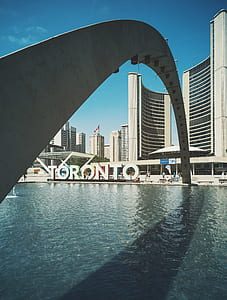 Toronto arch under clear blue sky during daytime thumbnail