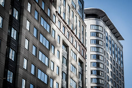 low angle photography of grey high rise building thumbnail