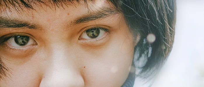 person's black eyes in macro shot thumbnail