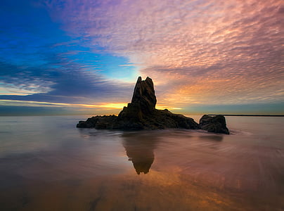 stone formation and body of water thumbnail