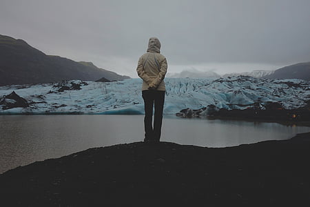 person standing near body of water thumbnail
