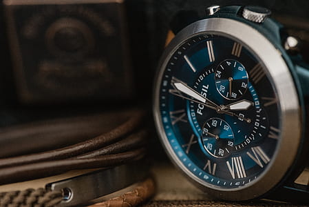 round silver-colored Fossil chronograph watch at 4:00 thumbnail