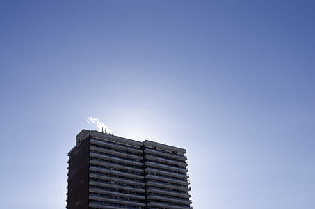 photo of blue building under clear sky thumbnail