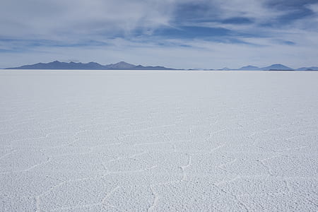 ice field under cloudy sky at daytime thumbnail