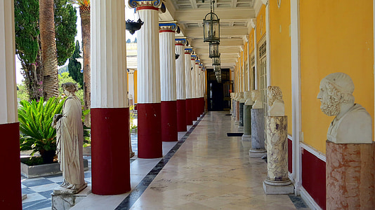 assorted white head bust on white marble hallway thumbnail