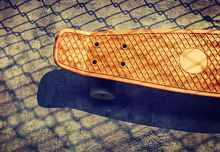 brown cruiser board on ground thumbnail