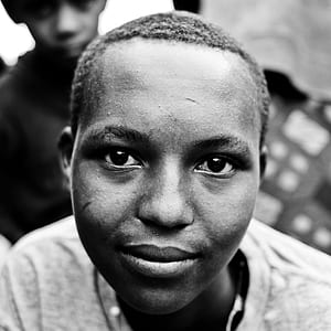 grayscale photo of boy thumbnail