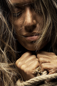 woman hand tied with rope thumbnail