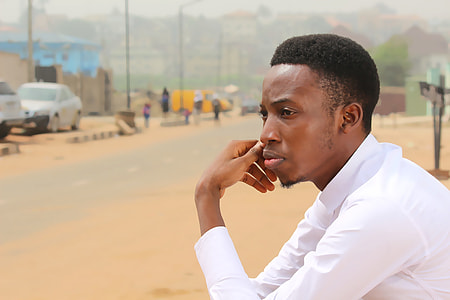 man holding his right cheek using his left hand thumbnail