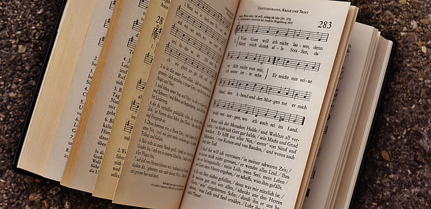 Song Book on Top of Brown Surface thumbnail
