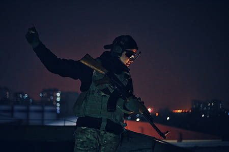 soldier holding his rifle looking down thumbnail