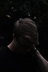 man standing during night time photo thumbnail