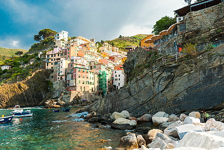 multicolored house on cliff photo thumbnail