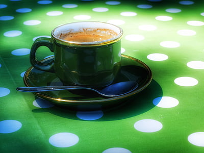 green ceramic cup filled with coffee thumbnail