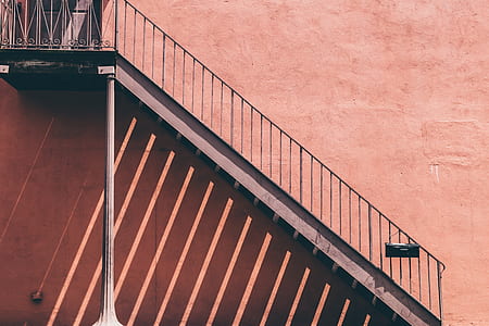 photo of staircase on pink painted wall thumbnail