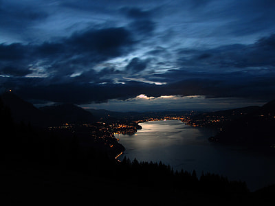 building lights near body of water during nighttime thumbnail