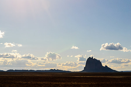 silhouette of mountains between sky and sand at daytime thumbnail