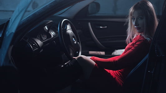 woman in red top inside a car thumbnail
