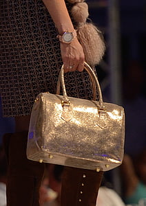 person holding gray leather handbag thumbnail