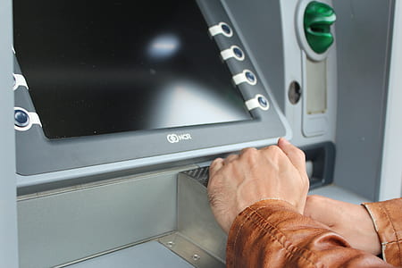 person's hands near gray machine thumbnail