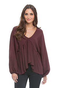 black haired woman wearing maroon long sleeve shirt thumbnail