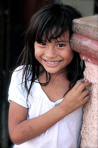 girl smiling beside post thumbnail