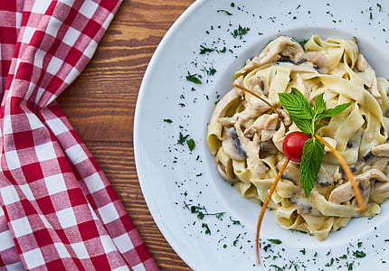 pasta with sauce on place near table thumbnail