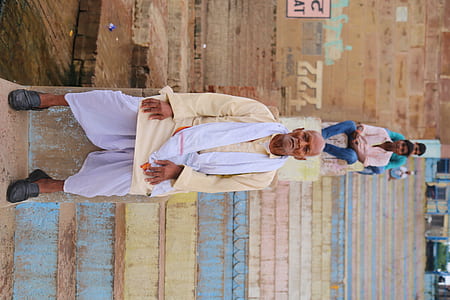man sitting on gray concrete staircase thumbnail