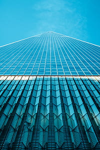 worm view of white and blue high-rise building thumbnail