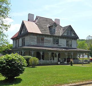 gray wooden 3-storey building thumbnail