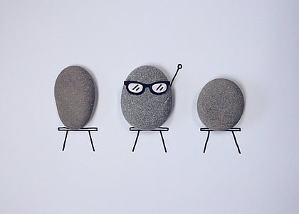three gray stone pebbles thumbnail